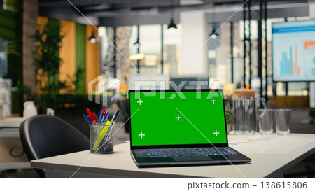 Chroma key display on a modern laptop in empty company workspace, HR department office space prepared for hiring process, interviews and career development plans. PC with mockup. 138615806