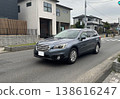 SUV driving on a residential street 138616247