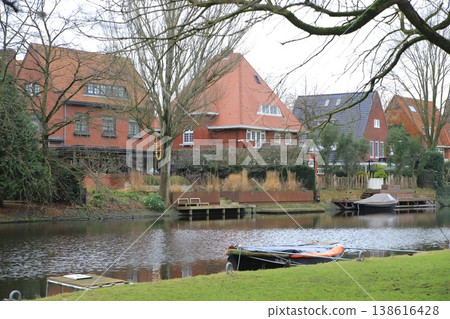 Residential areas and small boats along European canals Residential areas and small boats along European canals 138616428
