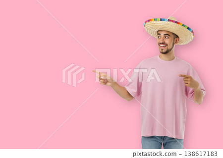 Cinco de Mayo, A young man wearing a sombrero points with a smile Cinco de Mayo, A young man wearing a sombrero points with a smile 138617183