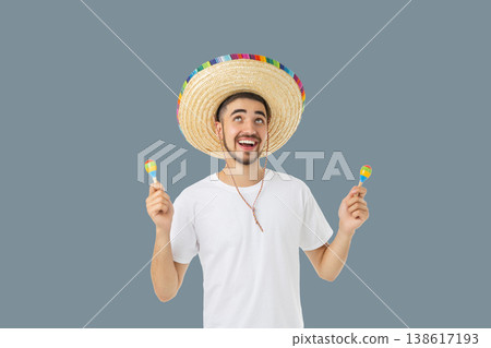 A young man celebrates Cinco de Mayo in a sombrero A young man celebrates Cinco de Mayo in a sombrero 138617193