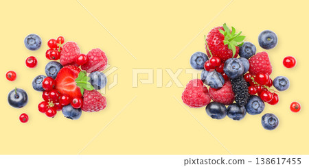 Berries cluster on a bright surface in vivid hues 138617455