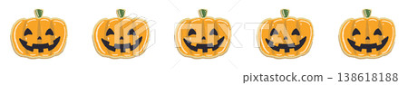 A line of Halloween decorations featuring smiling jack-o'-lanterns and sparsely arranged candy. 138618188