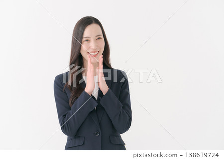 A woman in a suit who rejoices with a smile A woman in a suit who rejoices with a smile 138619724