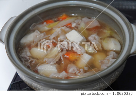 Making a hot pot with taro and pork. Making a hot pot with taro and pork. 138620383