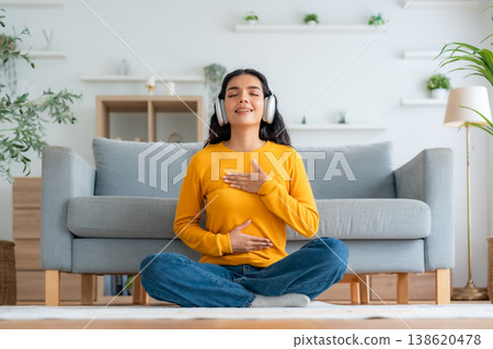 Happy young Asian woman practicing yoga and meditation at home Happy young Asian woman practicing yoga and meditation at home 138620478