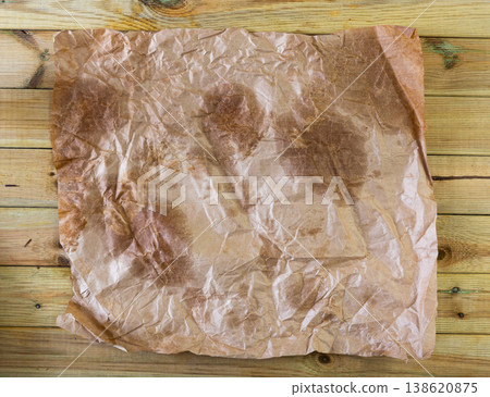 Vintage light brown crumpled paper sheet with stains Vintage light brown crumpled paper sheet with stains 138620875