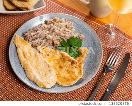 Delicious roasted turkey breast with buckwheat porridge on table Delicious roasted turkey breast with buckwheat porridge on table 138620876