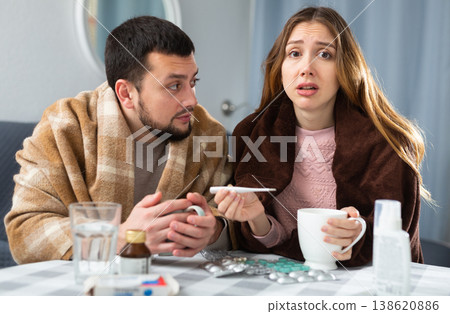 Sick couple suffering from flu at home Sick couple suffering from flu at home 138620886