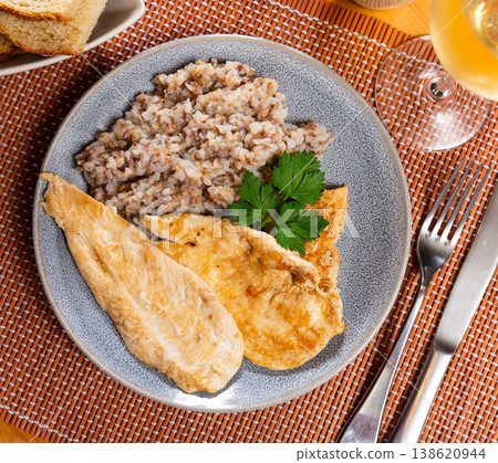 Delicious roasted turkey breast with buckwheat porridge on table Delicious roasted turkey breast with buckwheat porridge on table 138620944