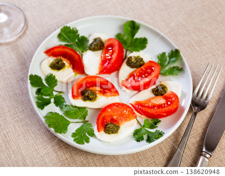 Caprese salad with pesto sauce and cilantro Caprese salad with pesto sauce and cilantro 138620948