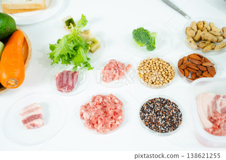 Food science and lab research with microscopes, test tubes, and organic ingredients. Perfect for showcasing food safety, innovation Food science and lab research with microscopes, test tubes, and organic ingredients. Perfect for showcasing food safety, innovation 138621255