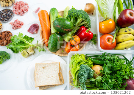 Top view of raw meat, fresh vegetables, grains, nuts, and legumes for health, nutrition, and diet planning. Perfect for food science and wellness lifestyle concepts. 138621262