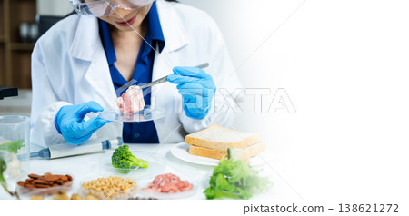 Close up of scientist testing meat sample in modern biotechnology lab for food quality, safety, and nutrition research. Close up of scientist testing meat sample in modern biotechnology lab for food quality, safety, and nutrition research. 138621272