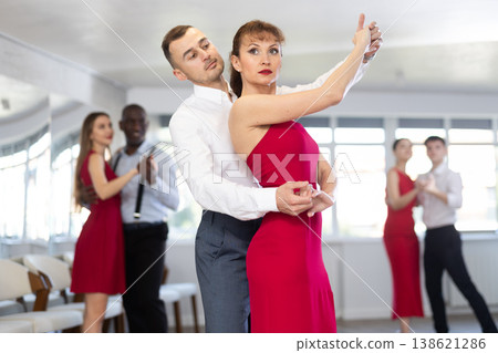 Adult man and adult woman dance waltz Adult man and adult woman dance waltz 138621286