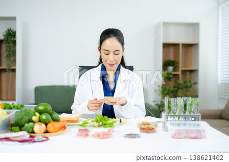 Scientist in a modern lab analyzing food samples with advanced equipment. Perfect for food science, research in  in food science and biotechnology 138621402