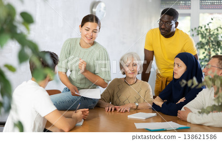 Group adult students different ages and multinational discussion during business course 138621586