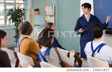 Male teacher conducts professional development lesson for workers 138621657