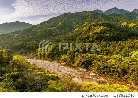 The dazzling dawn amidst the fresh greenery of Yakushima, where gods reside (Spring) 138621716