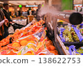 A sprayer is spraying a fruit stand with a mist 138622753