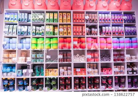 A store with many colorful items on shelves, including a pink pig A store with many colorful items on shelves, including a pink pig 138622757