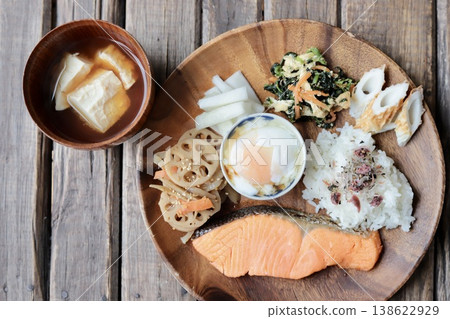 A healthy one-plate meal with grilled salmon and miso soup with crumbled tofu. A healthy one-plate meal with grilled salmon and miso soup with crumbled tofu. 138622929