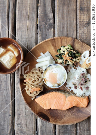 A healthy one-plate meal with grilled salmon and miso soup with crumbled tofu. A healthy one-plate meal with grilled salmon and miso soup with crumbled tofu. 138622930