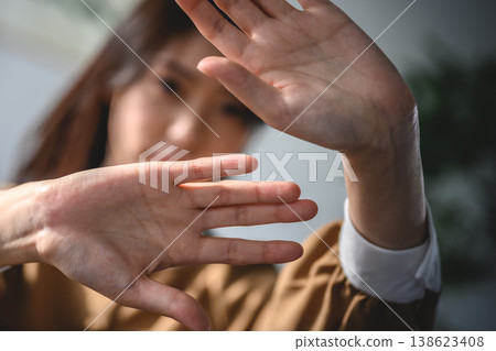 A woman rejects by raising her hand. A woman rejects by raising her hand. 138623408