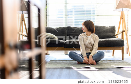 Young woman relaxing in the living room Young woman relaxing in the living room 138623465