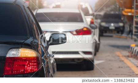 Rear side of black car with turn on turn right signal. Traffic jam on t junction road. Car prepare to turn right. Rear side of black car with turn on turn right signal. Traffic jam on t junction road. Car prepare to turn right. 138623482