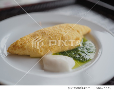 Freshly made omelet (with basil sauce) Freshly made omelet (with basil sauce) 138623630