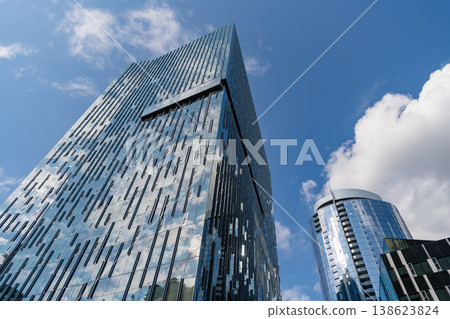City architecture. Architecture of office building. Perspective skyscraper. Commercial architecture. Business skyscraper building. Architectural building business area. Innovative glass design 138623824
