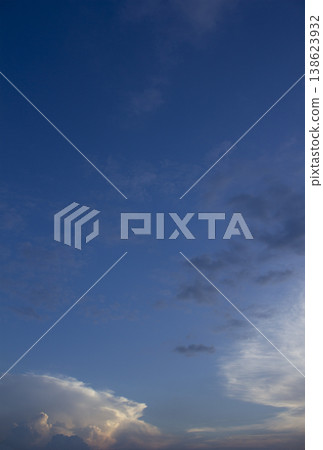 It is a sunset sky with feathery clouds. It is a sunset sky with feathery clouds. 138623932