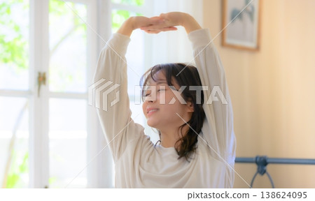 Woman doing morning stretching 138624095