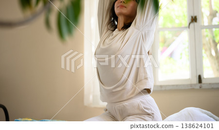 Women do stretches in the morning 138624101