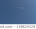 Contrails and the daytime moon 138624128