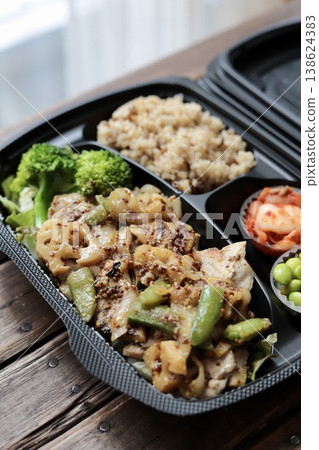 Healthy takeout bento box with mustard chicken and plenty of vegetables Healthy takeout bento box with mustard chicken and plenty of vegetables 138624383