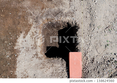 Marking the holes for embedding the "Fence Block 300 Type" with black string. Marking the holes for embedding the "Fence Block 300 Type" with black string. 138624560