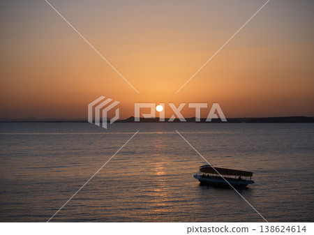 Sunrise over Lake Nasser and its calm surface—Egypt Sunrise over Lake Nasser and its calm surface—Egypt 138624614