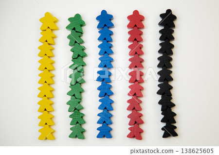 On a white background, men of different colors lie in a line, with a large man at the base, divided into teams. The concept of team competitions, community groups, people. High quality photo 138625605