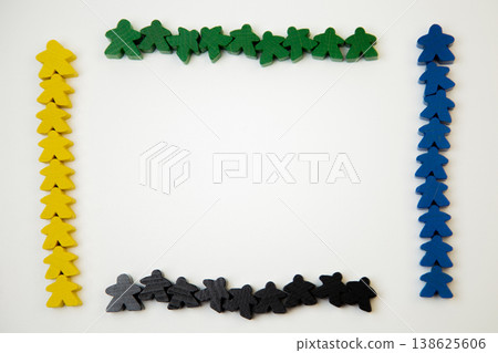 On a white background, there are four teams of yellow, blue, green and black wooden figures of men, divided into teams on the sides of the image with space for text in the center. The concept of team On a white background, there are four teams of yellow, blue, green and black wooden figures of men, divided into teams on the sides of the image with space for text in the center. The concept of team 138625606