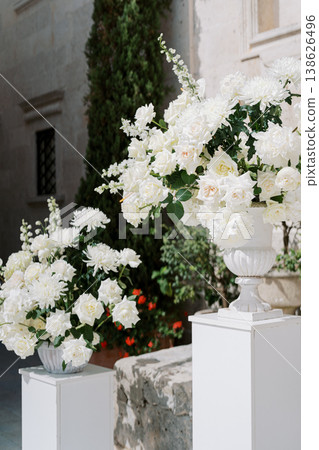 Romantic Floral Arrangements Enhancing Outdoor Villa Wedding Ambiance 138626496