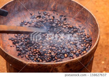 Roasted coffee beans in a rustic bowl Roasted coffee beans in a rustic bowl 138627637