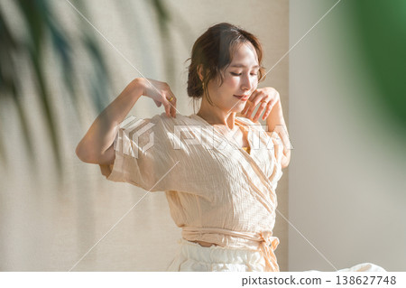 A woman doing yoga in the living room of her home (relaxation, health care, meditation) A woman doing yoga in the living room of her home (relaxation, health care, meditation) 138627748