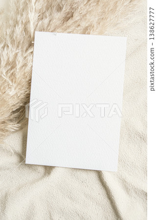 Blank paper mockup on fabric with dried grass aesthetic neutral background minimal composition natural light copy space Blank paper mockup on fabric with dried grass aesthetic neutral background minimal composition natural light copy space 138627777