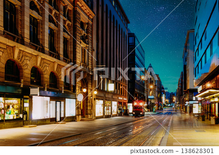 Helsinki, Finland. Night View Of Aleksanterinkatu Street In Kluuvi District In Evening Or Night Illumination. Illuminated City Street in Helsinki at Night Helsinki, Finland. Night View Of Aleksanterinkatu Street In Kluuvi District In Evening Or Night Illumination. Illuminated City Street in Helsinki at Night 138628301