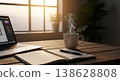 Work desk with laptop, notebook, pen and coffee cup in morning sunlight 138628808