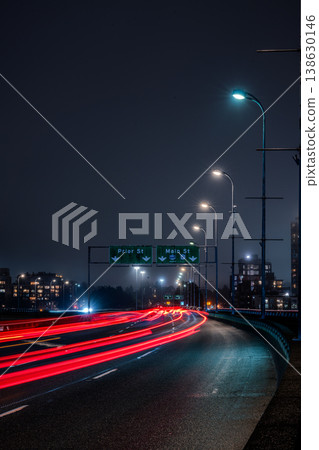 Cars driving on an elevated highway at night in Vancouver, Canada 138630146