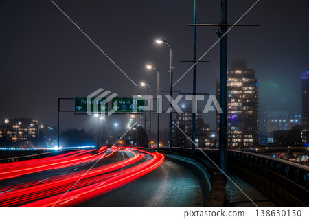 Cars driving on an elevated highway at night in Vancouver, Canada 138630150