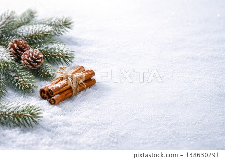 Winter holiday background with pine branches cones and cinnamon on snow 138630291